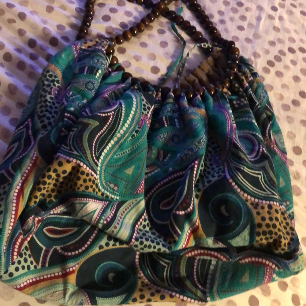 Beautiful hobo bag with wooden bead handles.